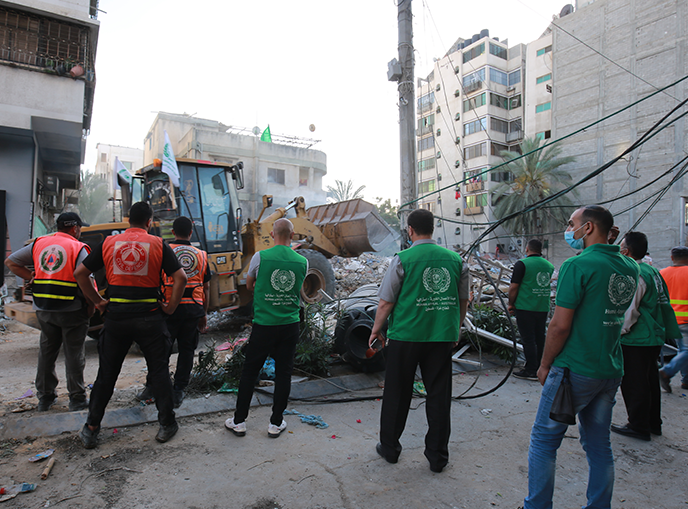 Human Appeal Field Workers cooperating with Civil Defense Command to clear rubble in Gaza