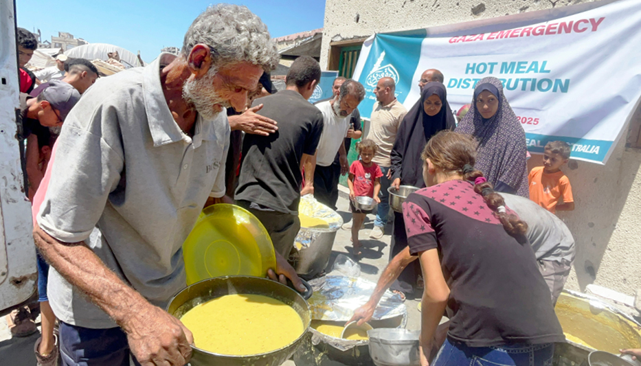 Volunteers distributing food packages to families facing food insecurity