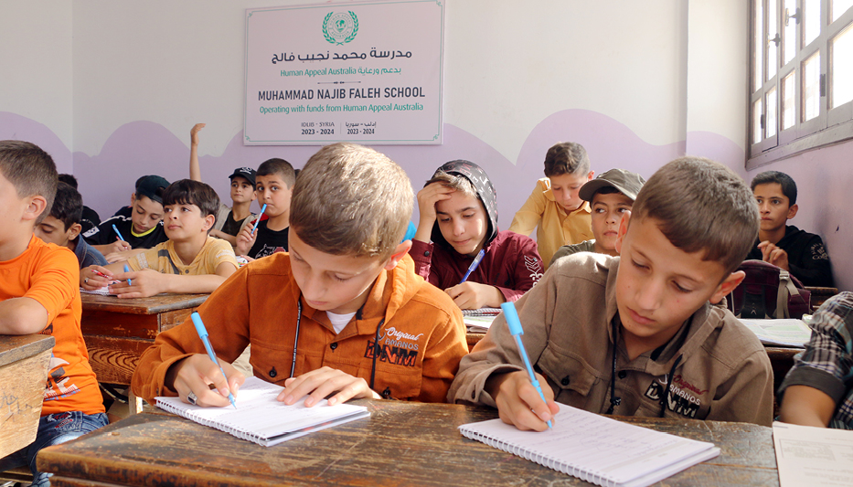 Children learning in a classroom supported by education programs