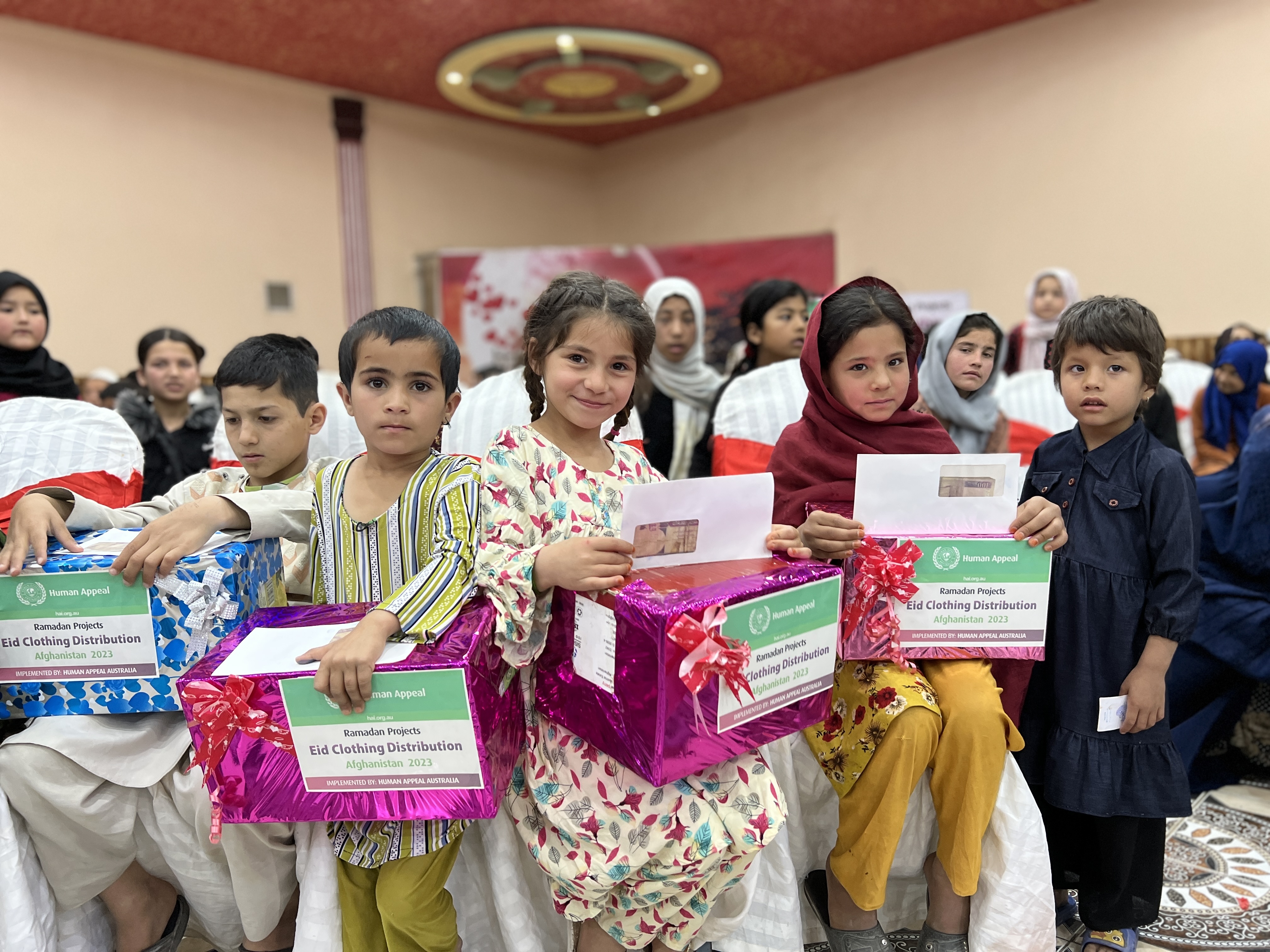 Children smiling and participating in an orphan sponsorship program
