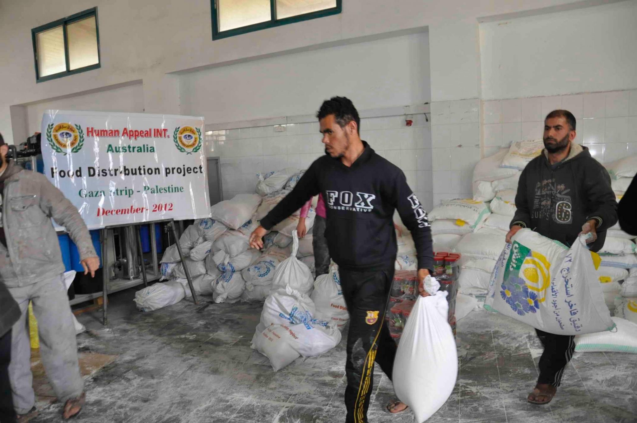 Aid workers distributing supplies during a large-scale emergency